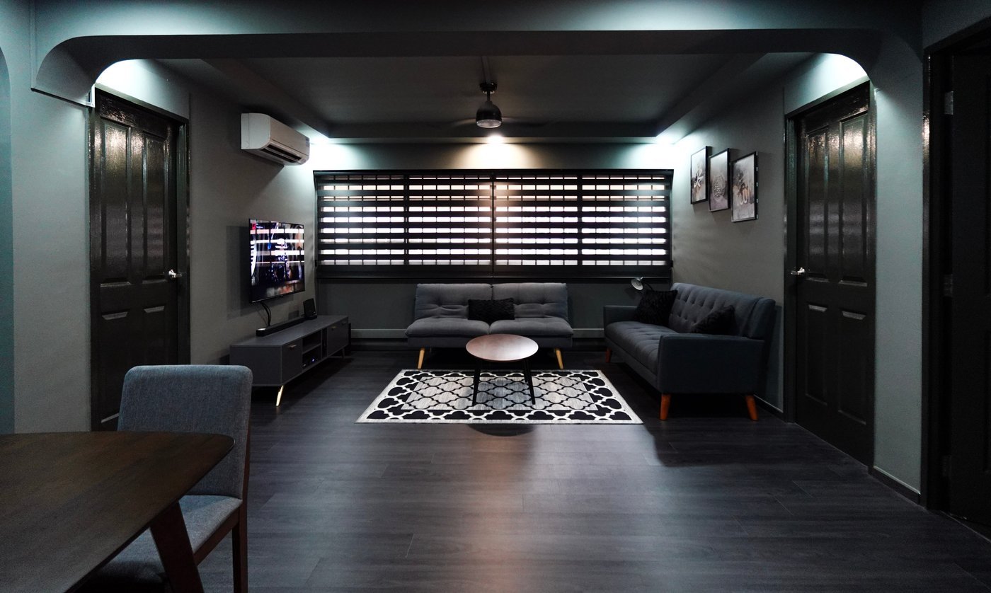 Open-concept living and dining renovation layout with curated warm lighting